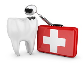 tooth next to a first aid kit