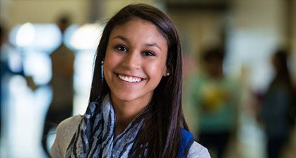 Smiling young woman with beautfiul straight teeth