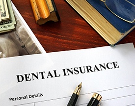 A dental insurance form resting on a table.