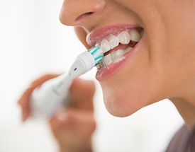 Woman brushing her teeth