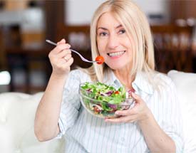 Woman eating a salad in Cumming