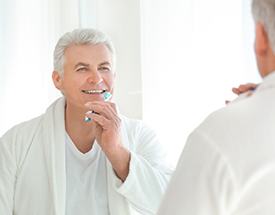 Man brushing teeth in Cumming