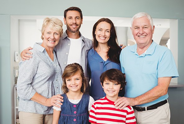 Three generations of family smiling together