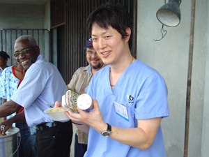 Dr. Lee eating with team