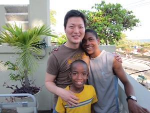 Dr. Brian Lee posing with patients