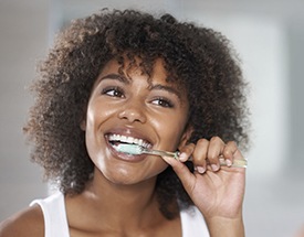 Woman brushing teeth