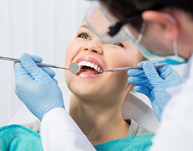 Woman receiving oral cancer screening