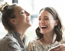 Two women laughing together