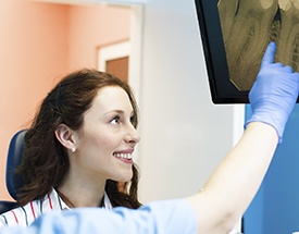 Smiling patient looking at x-rays