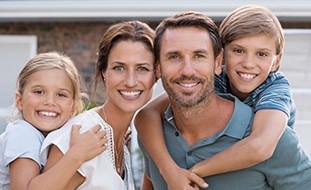 Smiling family of four