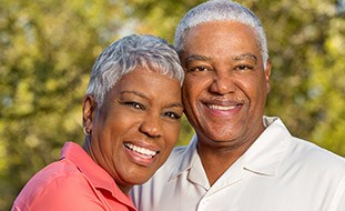 Senior couple smiling outdoors