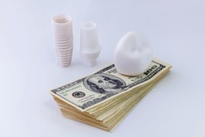 dental implant on money