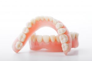 Dentures in Cumming on a white background