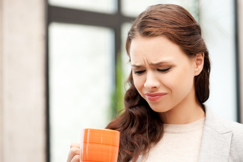 Woman with bitter taste in mouth