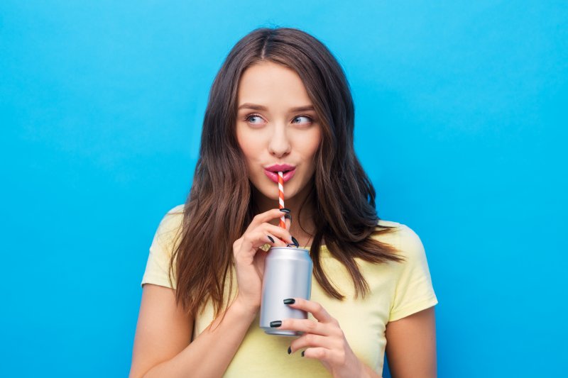 woman drinking through a straw in Cumming