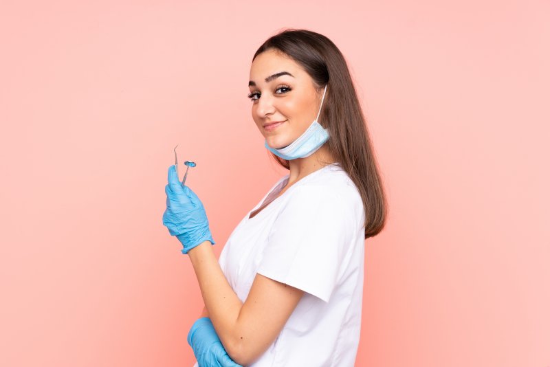 dentist smiling confidently at the camera