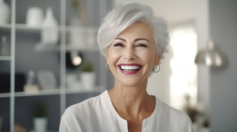 Older woman admiring her smile aesthetics