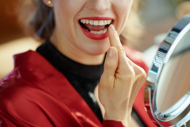 Woman smiling after teeth whitening